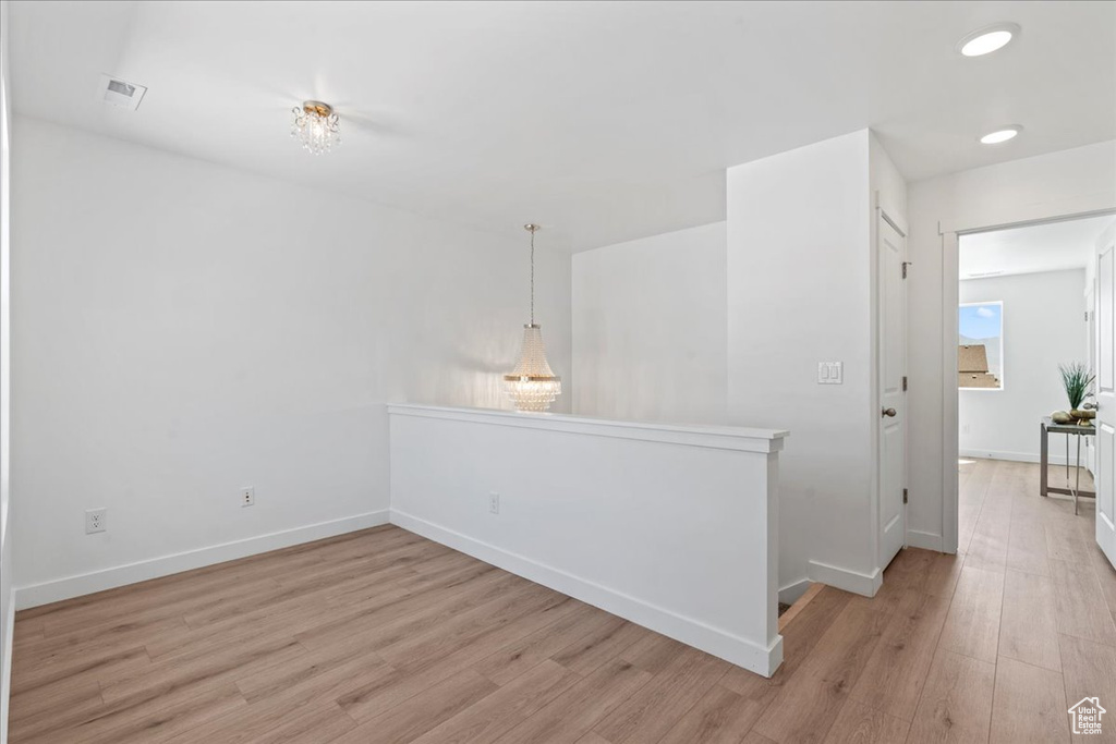 Spare room featuring light wood-type flooring