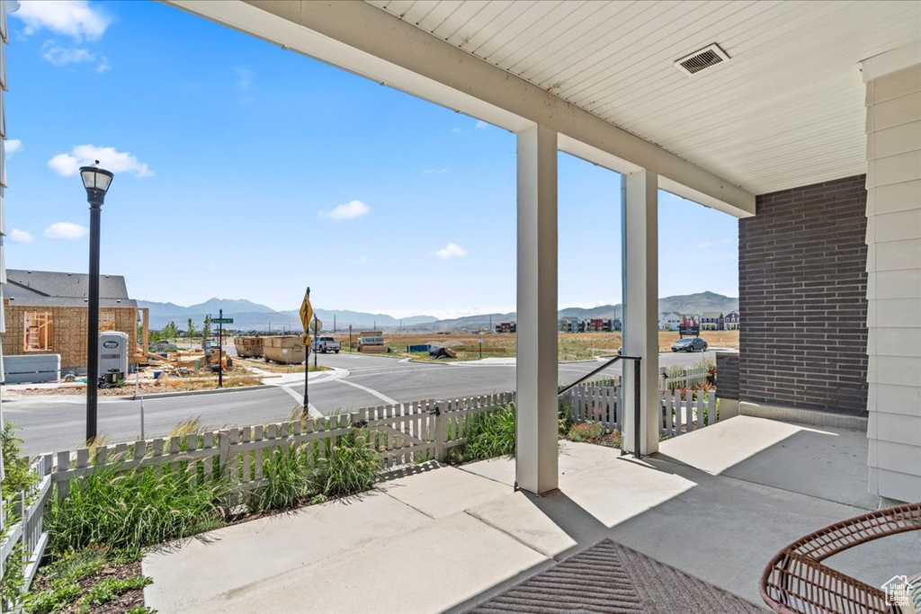 Covered porch with a mountain view