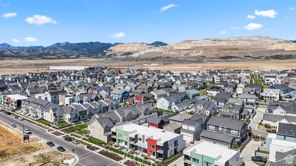 Aerial view of residential area featuring a mountain backdrop