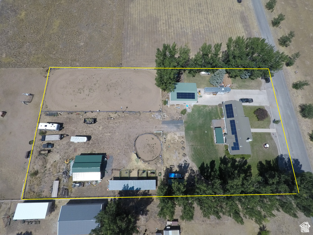 Aerial view of property and surrounding area featuring property parcel outlined