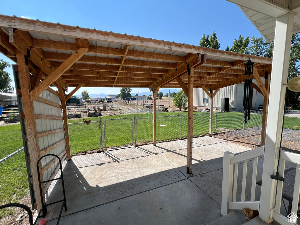 View of patio featuring a gate