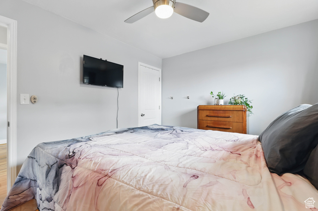 Bedroom with wood finished floors and a ceiling fan