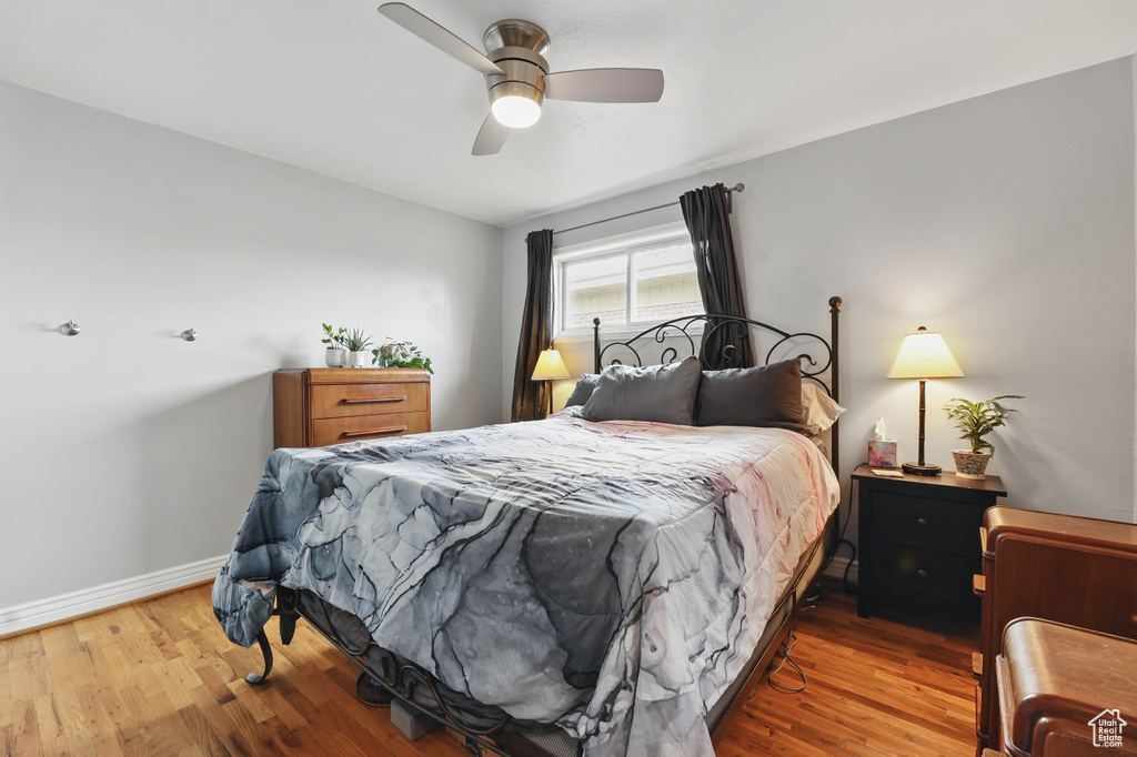 Bedroom with wood finished floors and ceiling fan