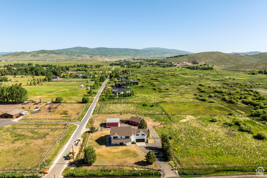 Aerial view of sparsely populated area with a mountain backdrop