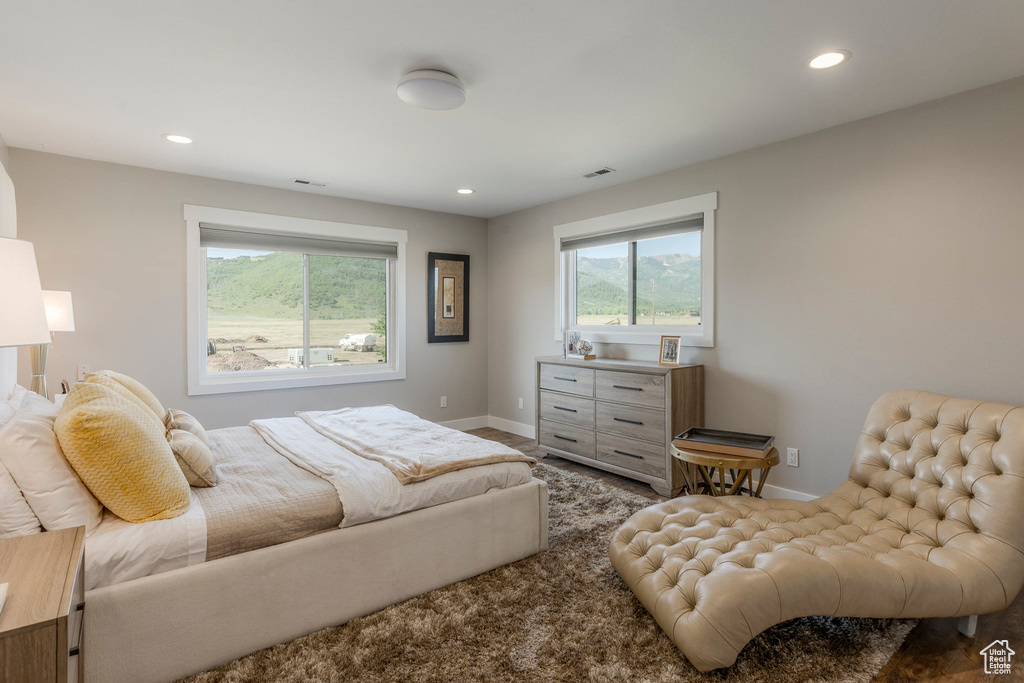 Bedroom with recessed lighting and baseboards