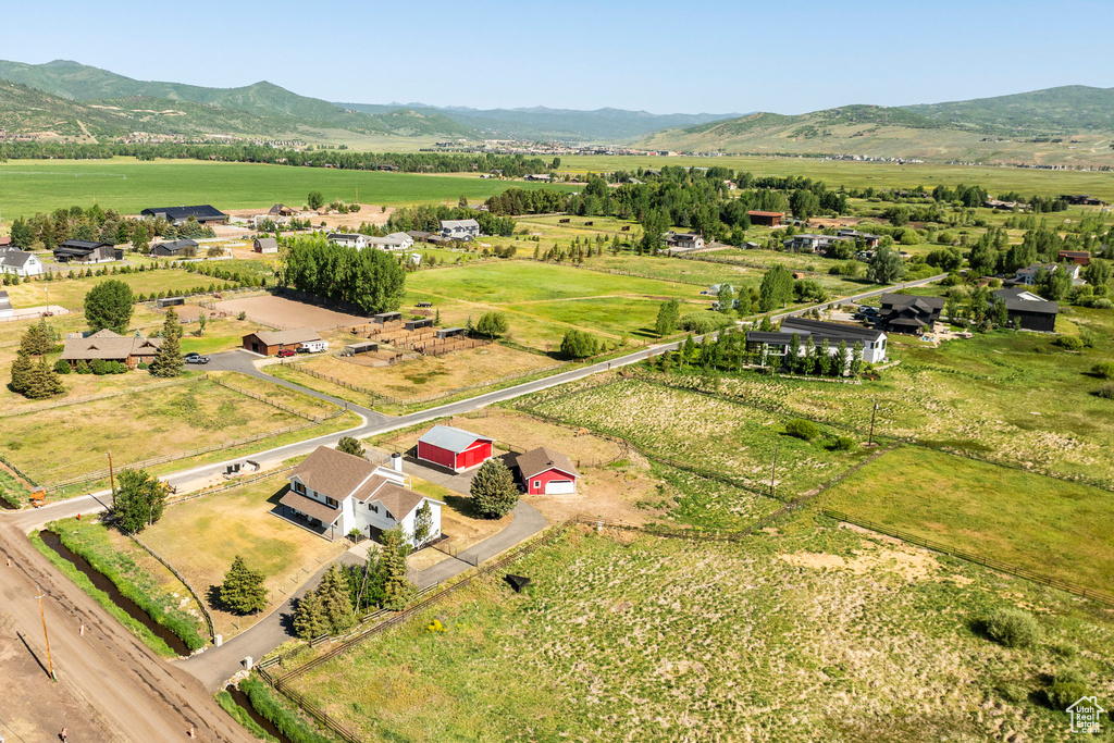 Overview of rural landscape with a mountain backdrop