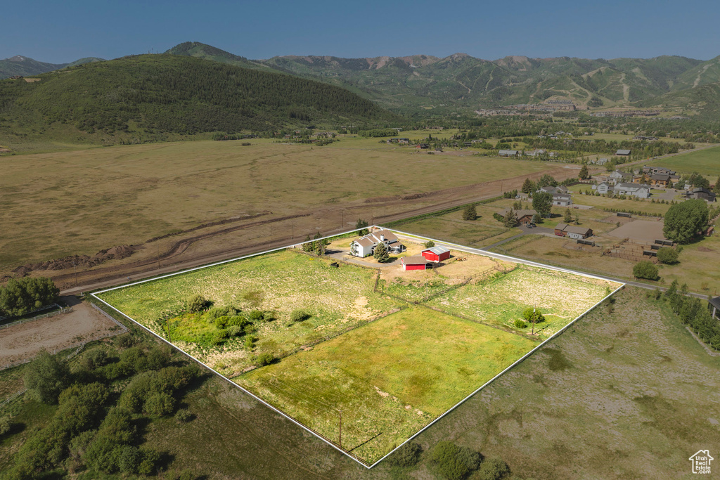 View of rural area featuring property boundaries highlighted and a mountainous background