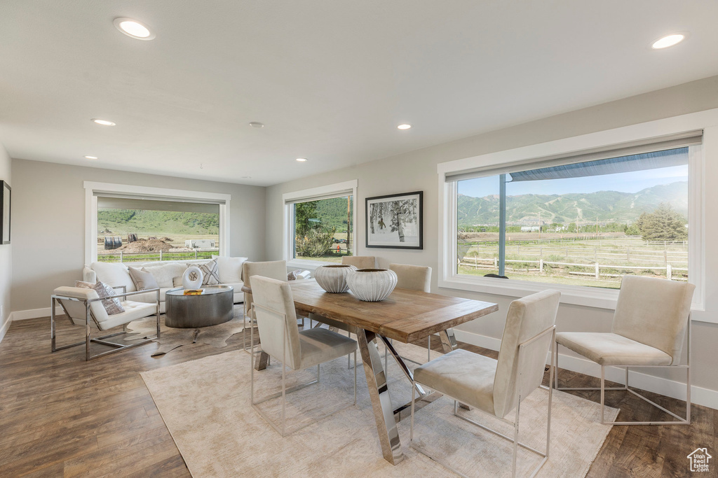 Dining area with wood finished floors, recessed lighting, and a mountain view