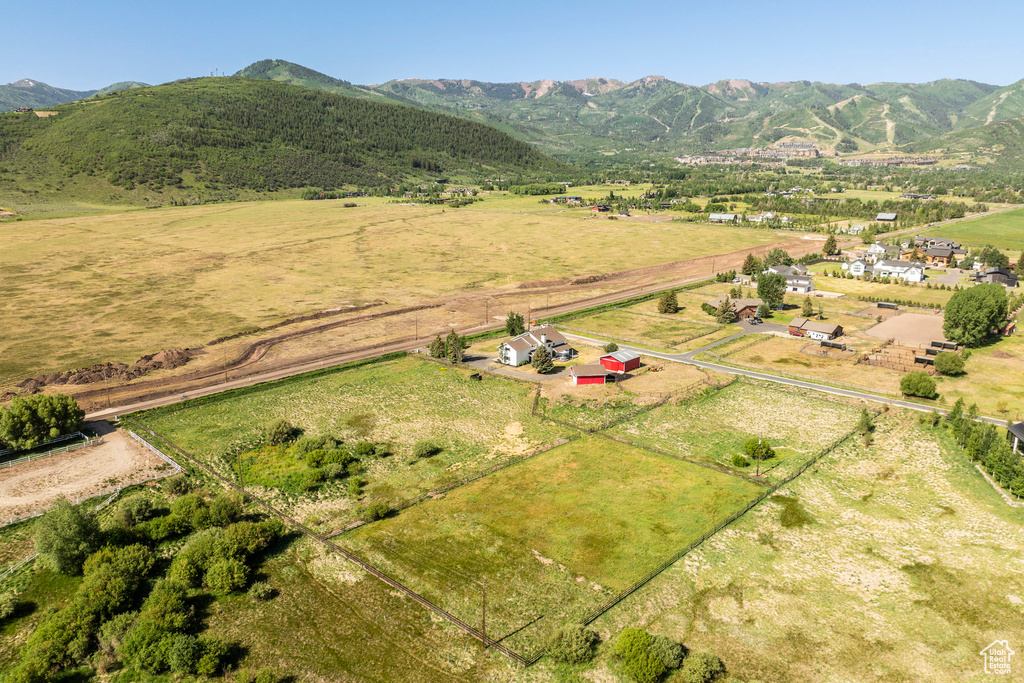 Aerial view of sparsely populated area with a mountainous background