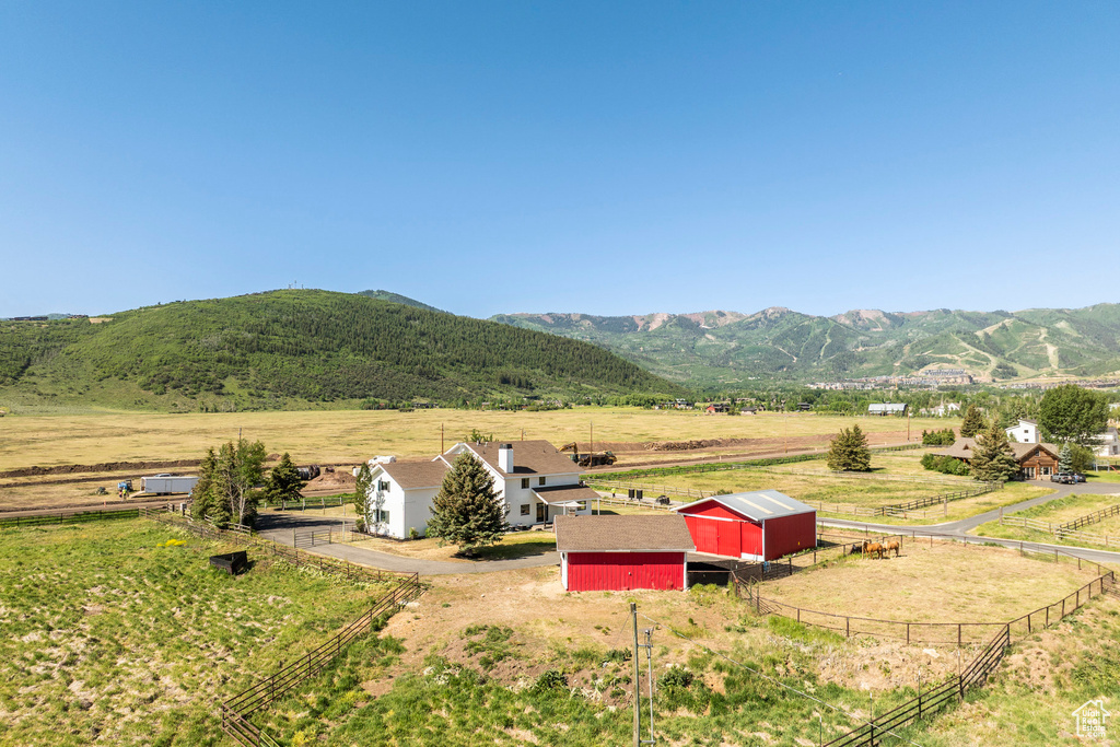 View of mountain backdrop with rural landscape