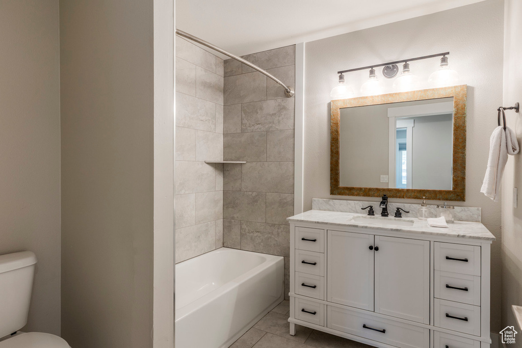 Bathroom featuring vanity and shower / washtub combination