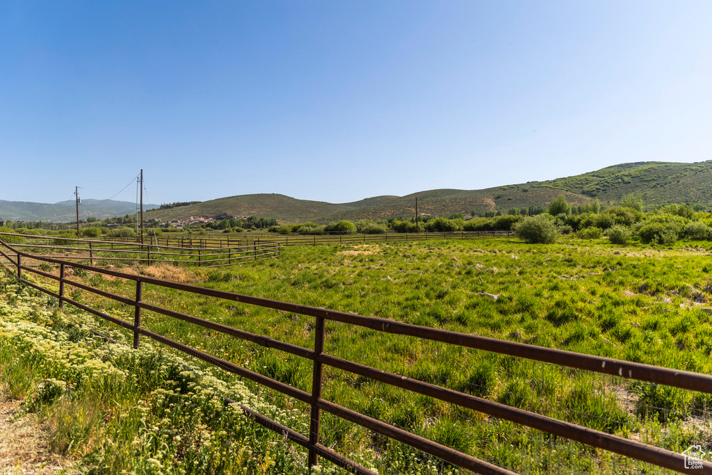 View of mountain backdrop with rural landscape