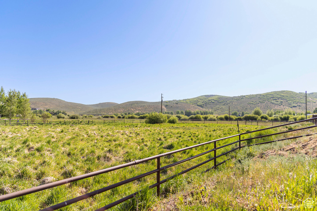 View of mountain background featuring rural landscape