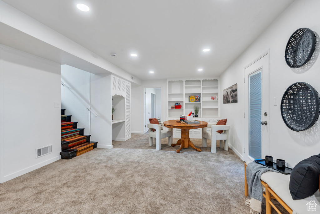 Dining room with recessed lighting, stairs, and carpet floors