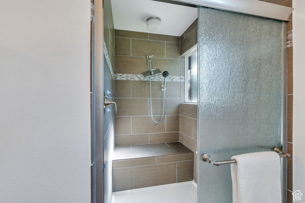 Full bath featuring a shower stall
