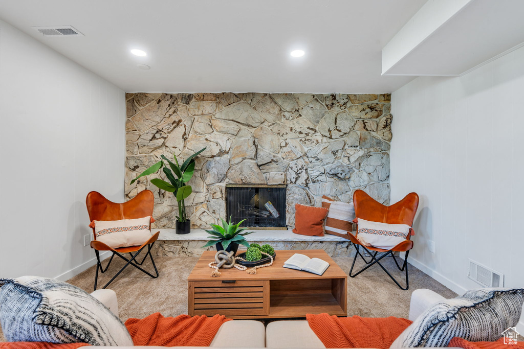 Carpeted living area with baseboards