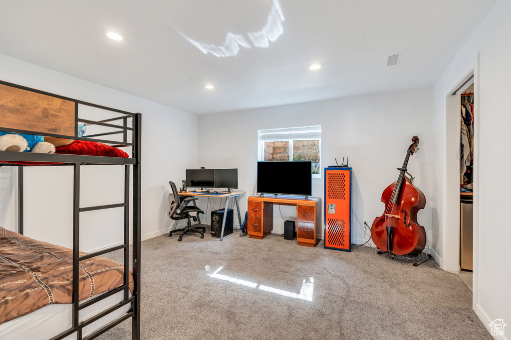 Bedroom featuring carpet flooring, recessed lighting, and a desk