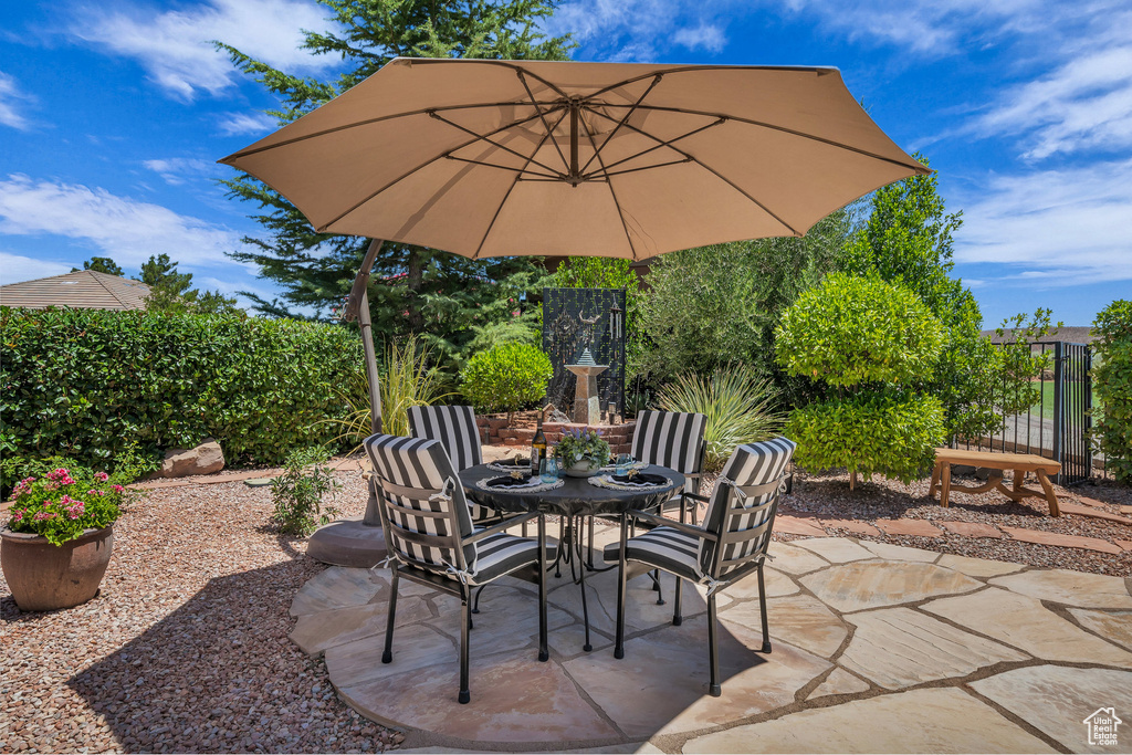 View of patio with outdoor dining area