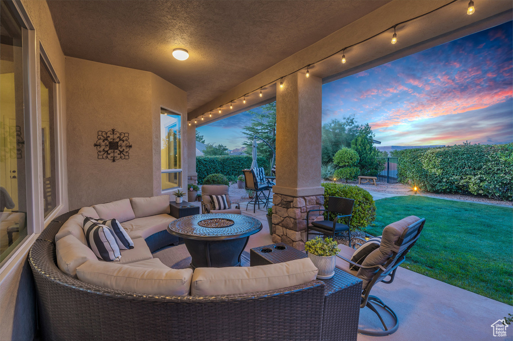 View of patio / terrace with an outdoor living space with a fire pit