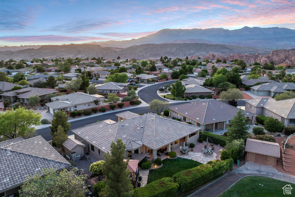 Aerial view at dusk of a residential view and a mountain view