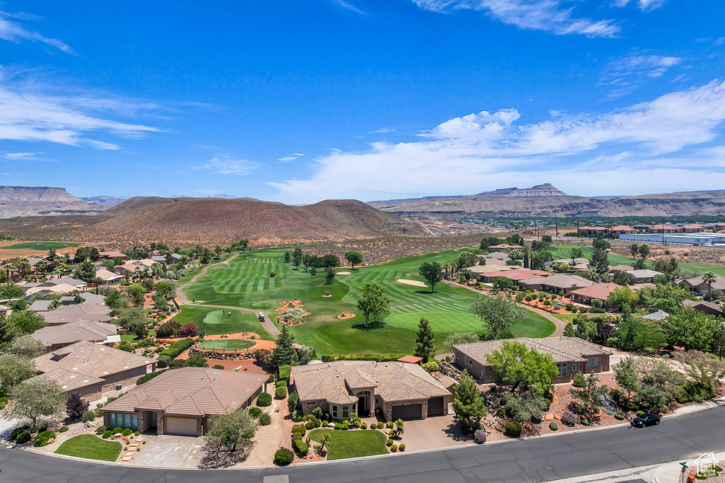 Mountain view with nearby suburban area and a golf club