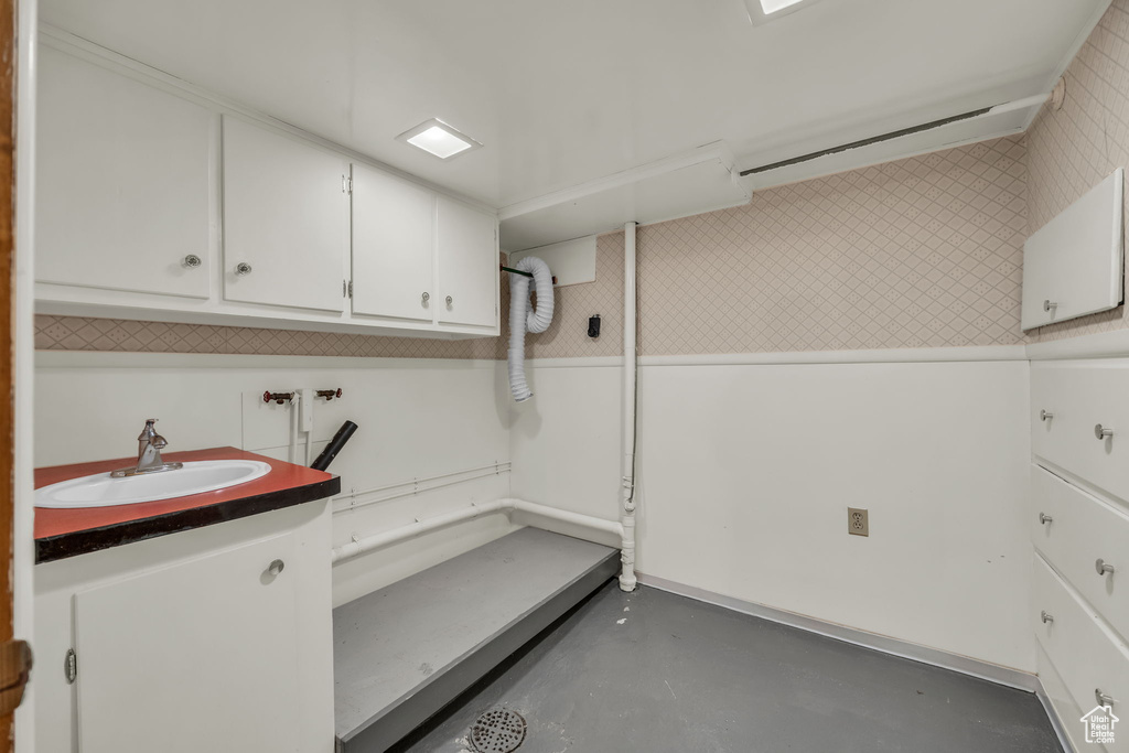 Laundry room with cabinet space and hookup for a washing machine