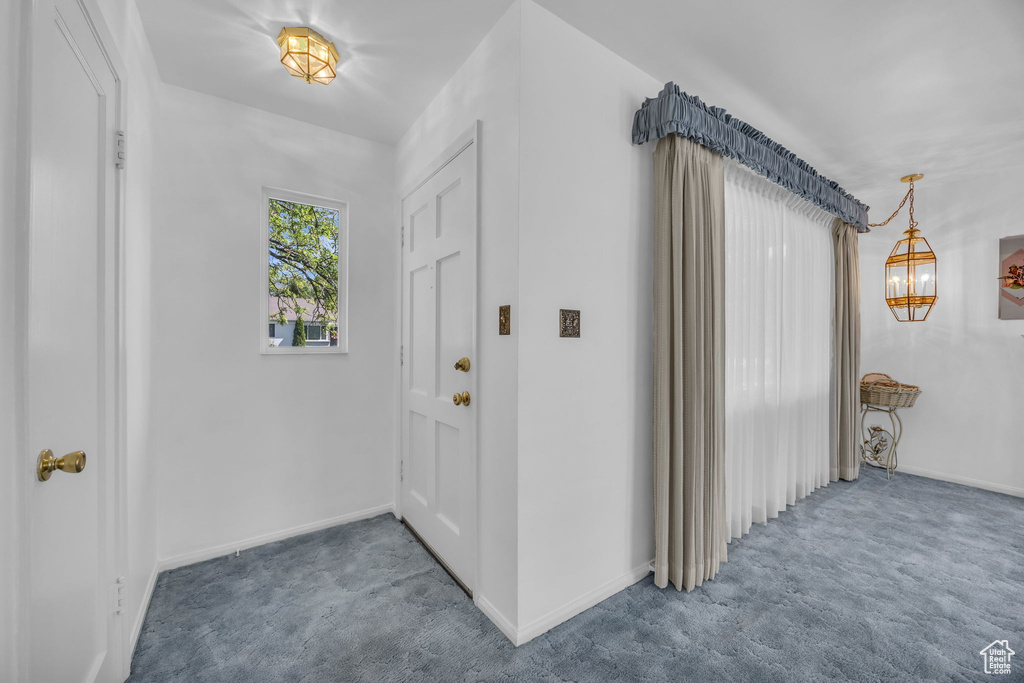 Entrance foyer with carpet flooring