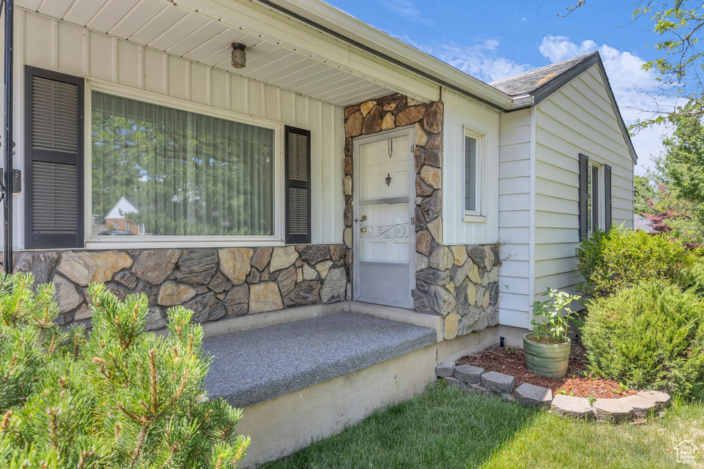 View of exterior entry with stone siding