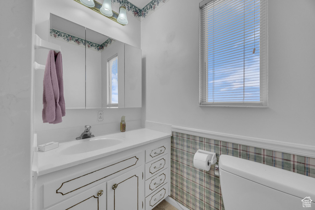 Bathroom featuring healthy amount of natural light and vanity