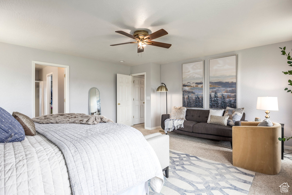 Bedroom featuring light colored carpet and a ceiling fan