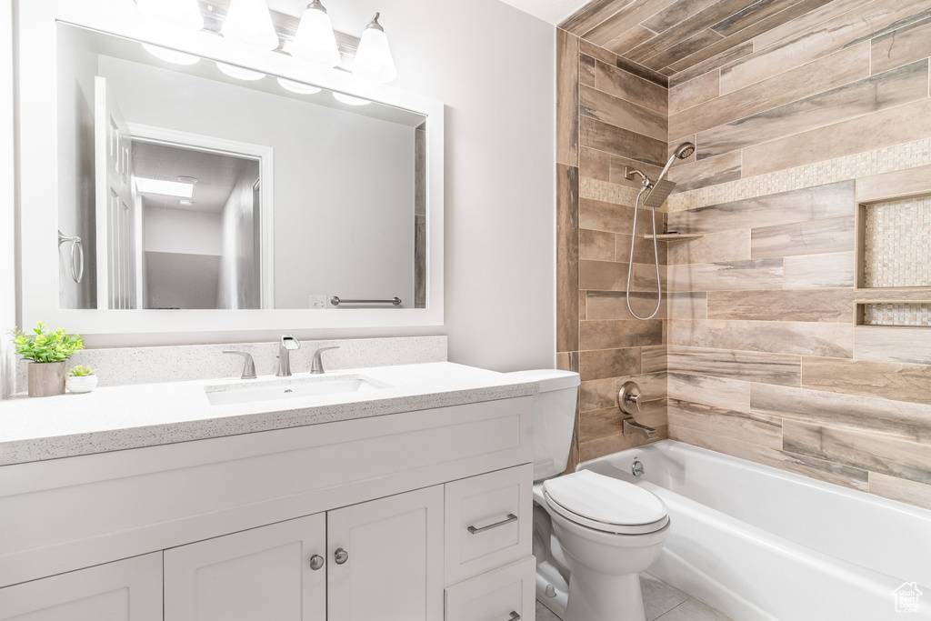 Bathroom featuring vanity and shower / tub combination