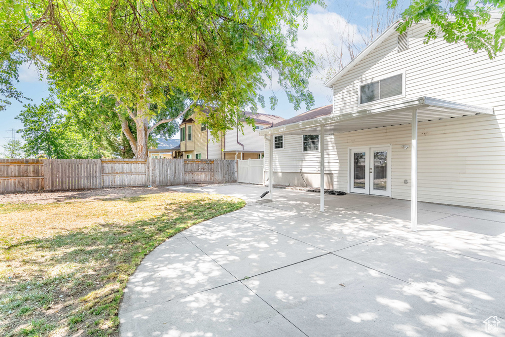 Rear view of house featuring french doors and a patio