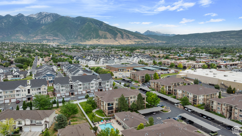 Aerial perspective of suburban area with a mountain backdrop