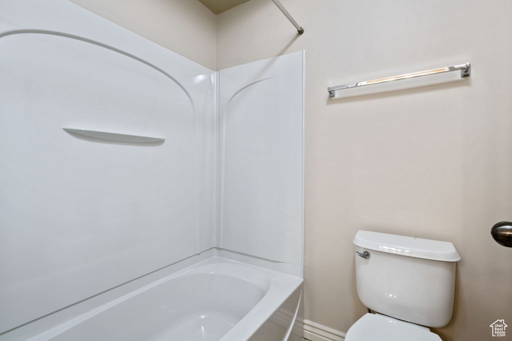 Bathroom with toilet and shower / bathtub combination