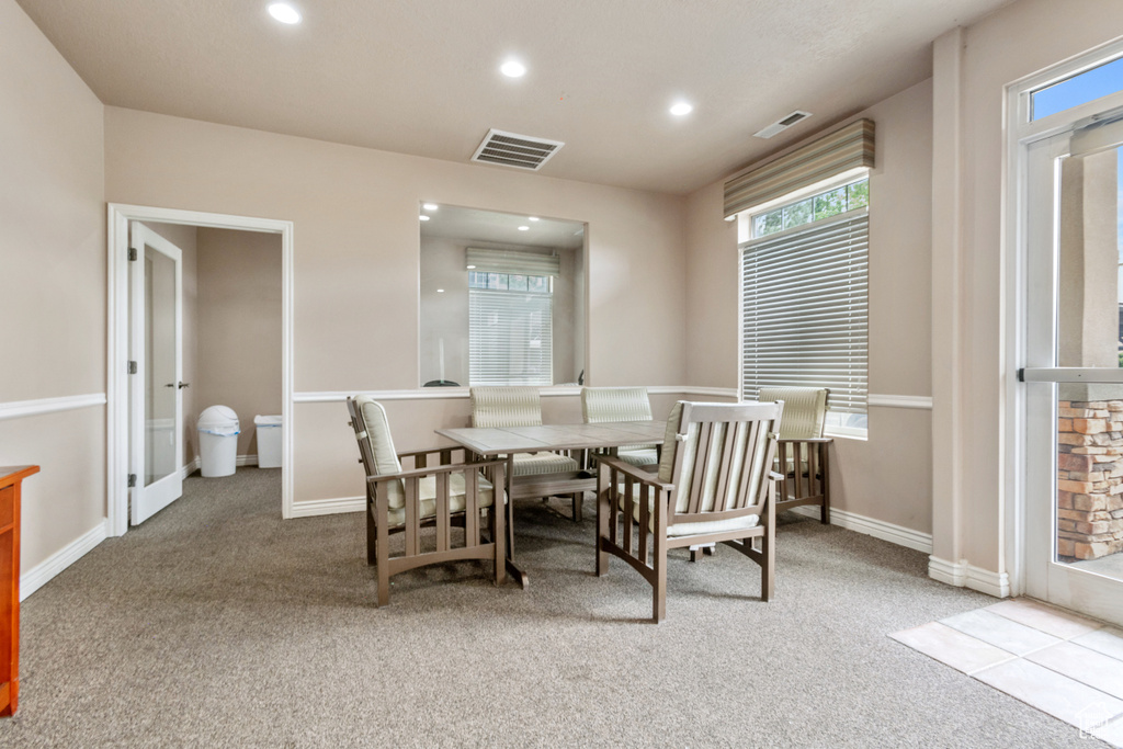 Dining room featuring carpet floors and recessed lighting