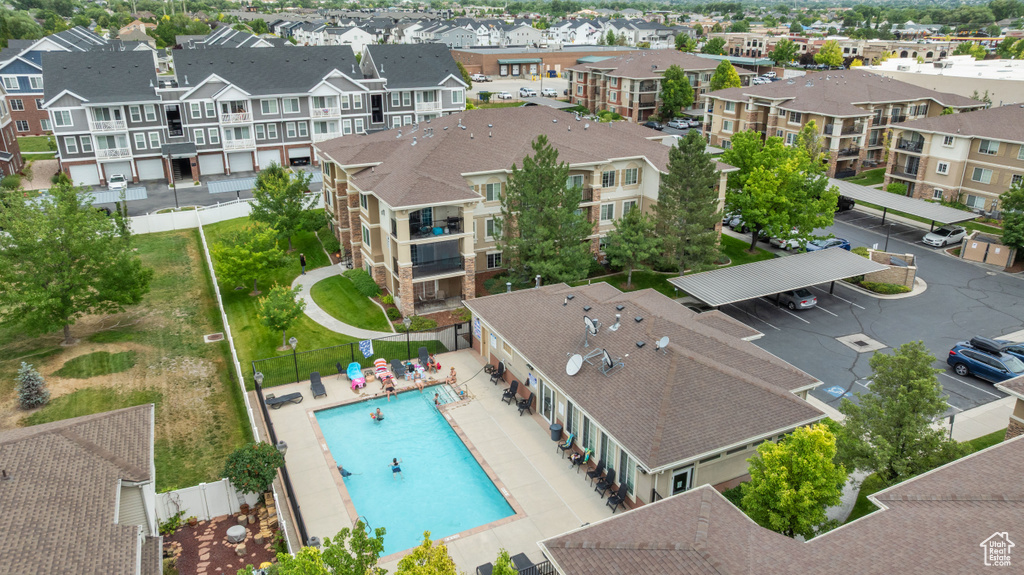 Aerial view of residential area featuring a pool area