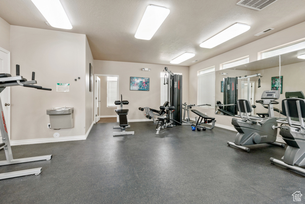 Workout area featuring a textured ceiling