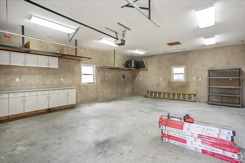 Garage featuring a garage door opener