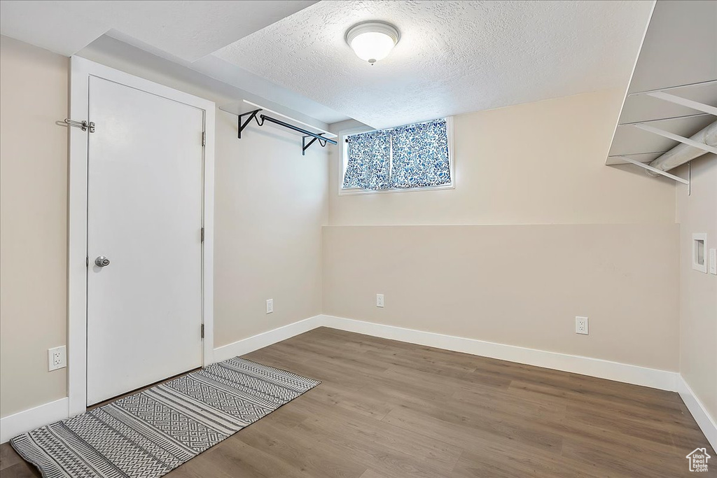 Walk in closet featuring wood finished floors