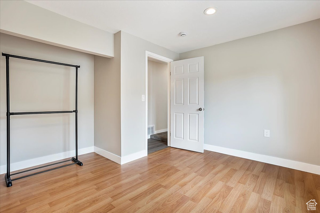 Unfurnished bedroom featuring light wood-type flooring and recessed lighting