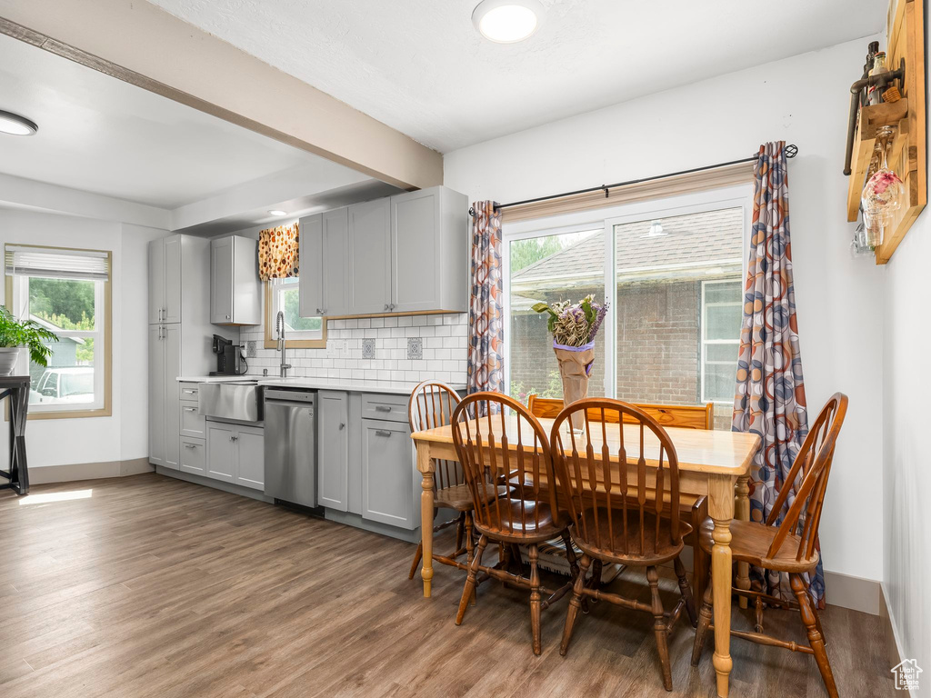 Dining space featuring wood finished floors and baseboards