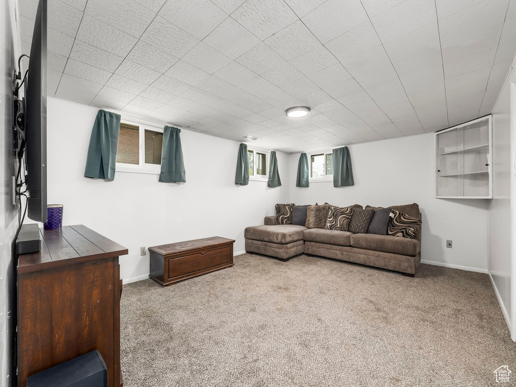 Living room with carpet flooring and baseboards