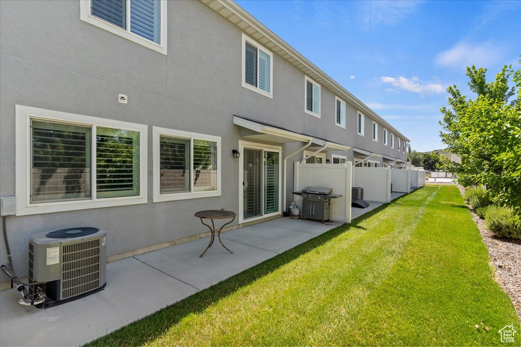Back of property featuring stucco siding and a patio area