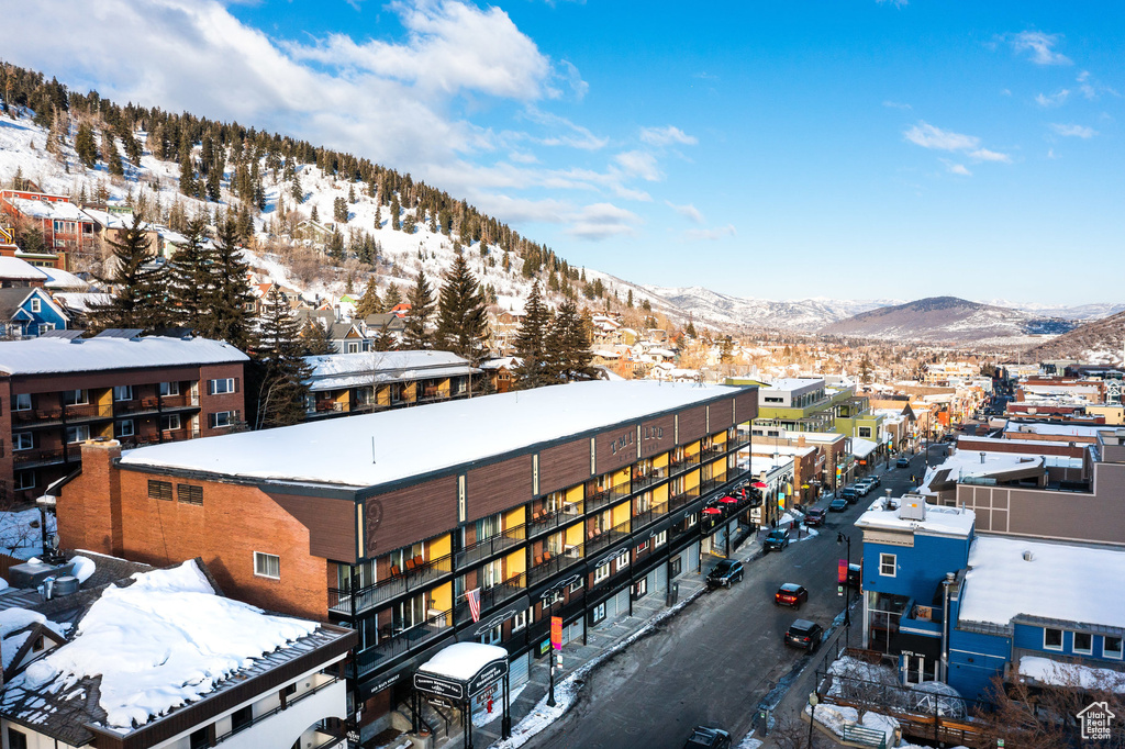 Snowy aerial view featuring a mountain view
