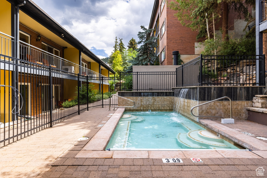 View of swimming pool with a pool