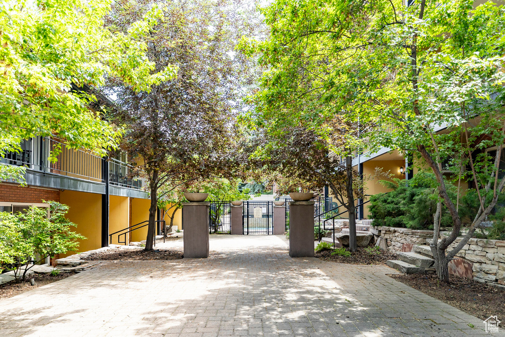 View of home's community with a gate
