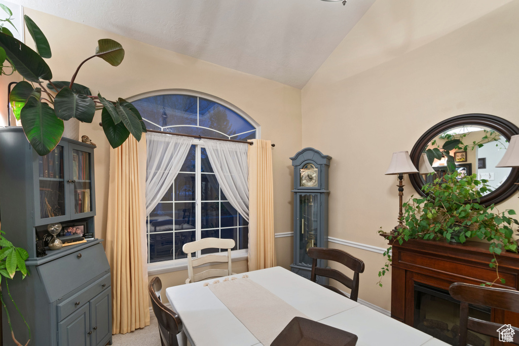 Dining space featuring lofted ceiling