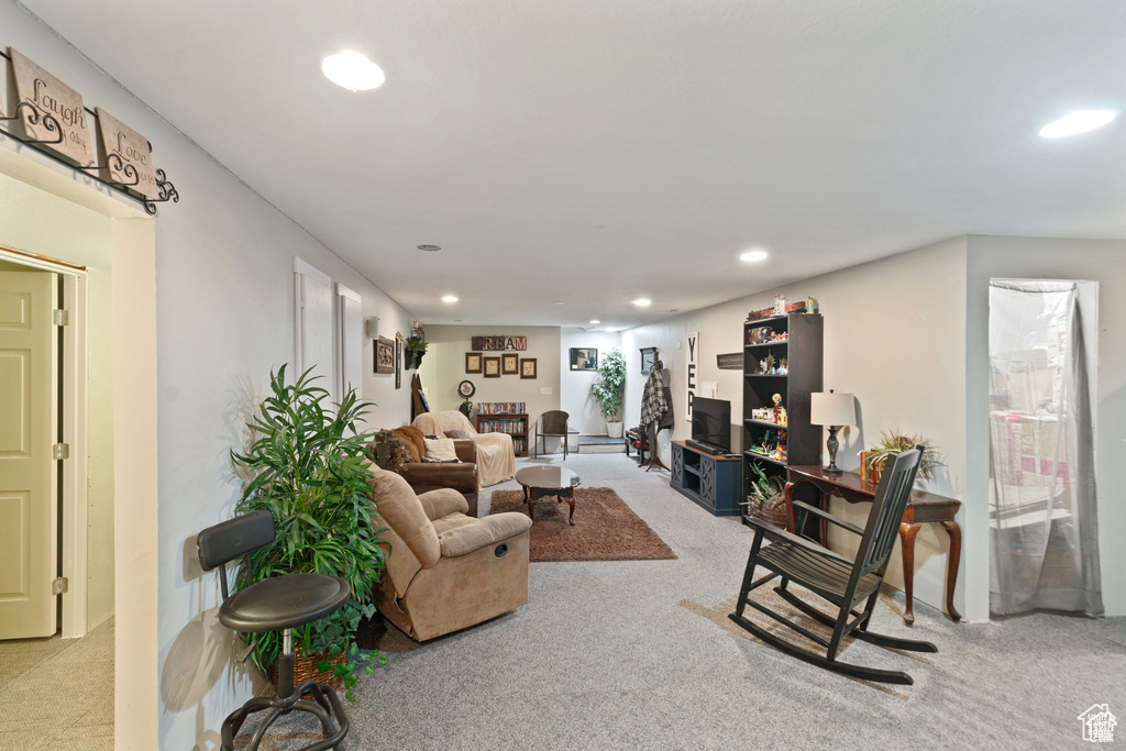 Living room with recessed lighting and carpet
