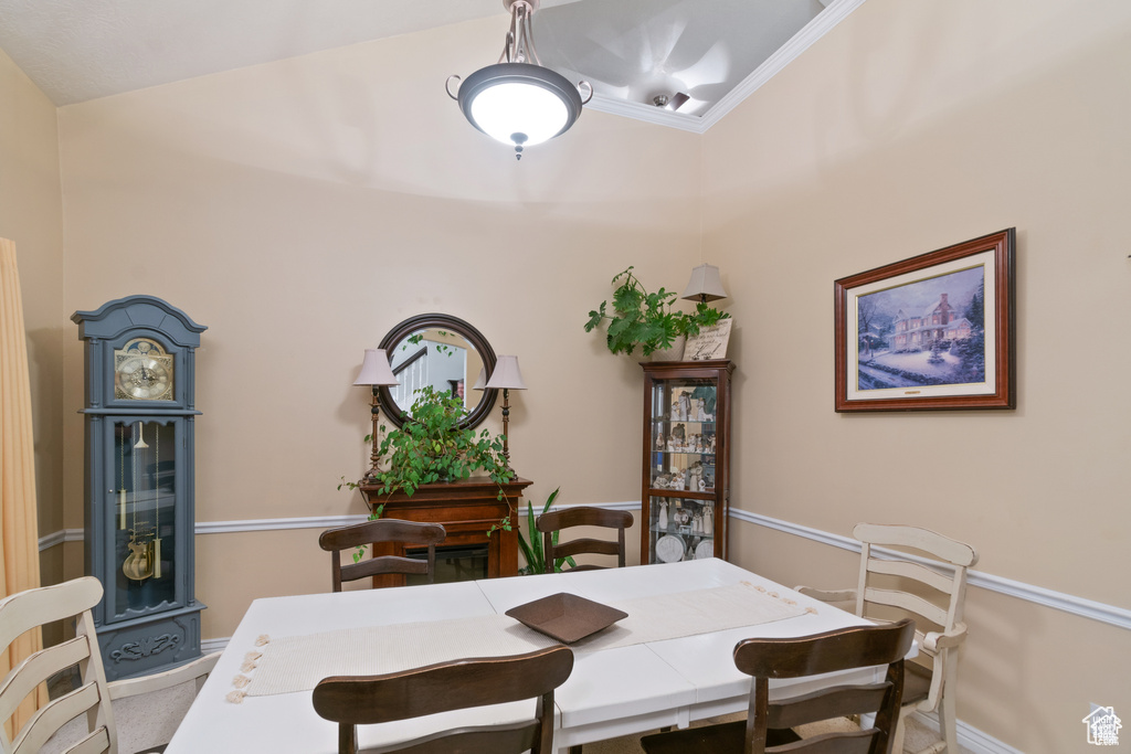 Dining area featuring baseboards and ornamental molding