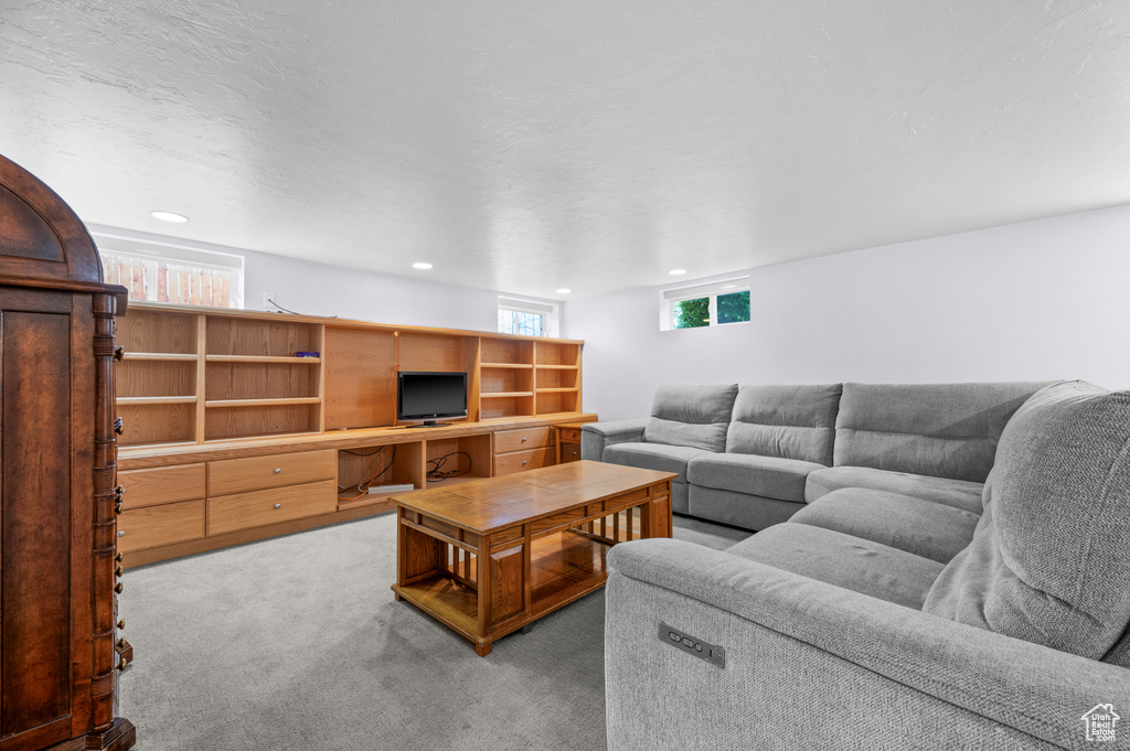 Living room featuring light colored carpet and recessed lighting